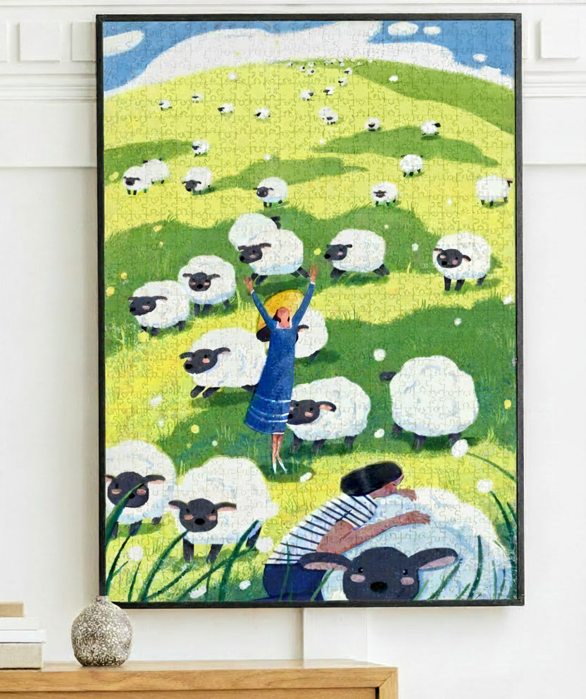 Jigsaw puzzle box with a design of a woman and sheep on a grassy field, featuring the brand 'kibifufu'.